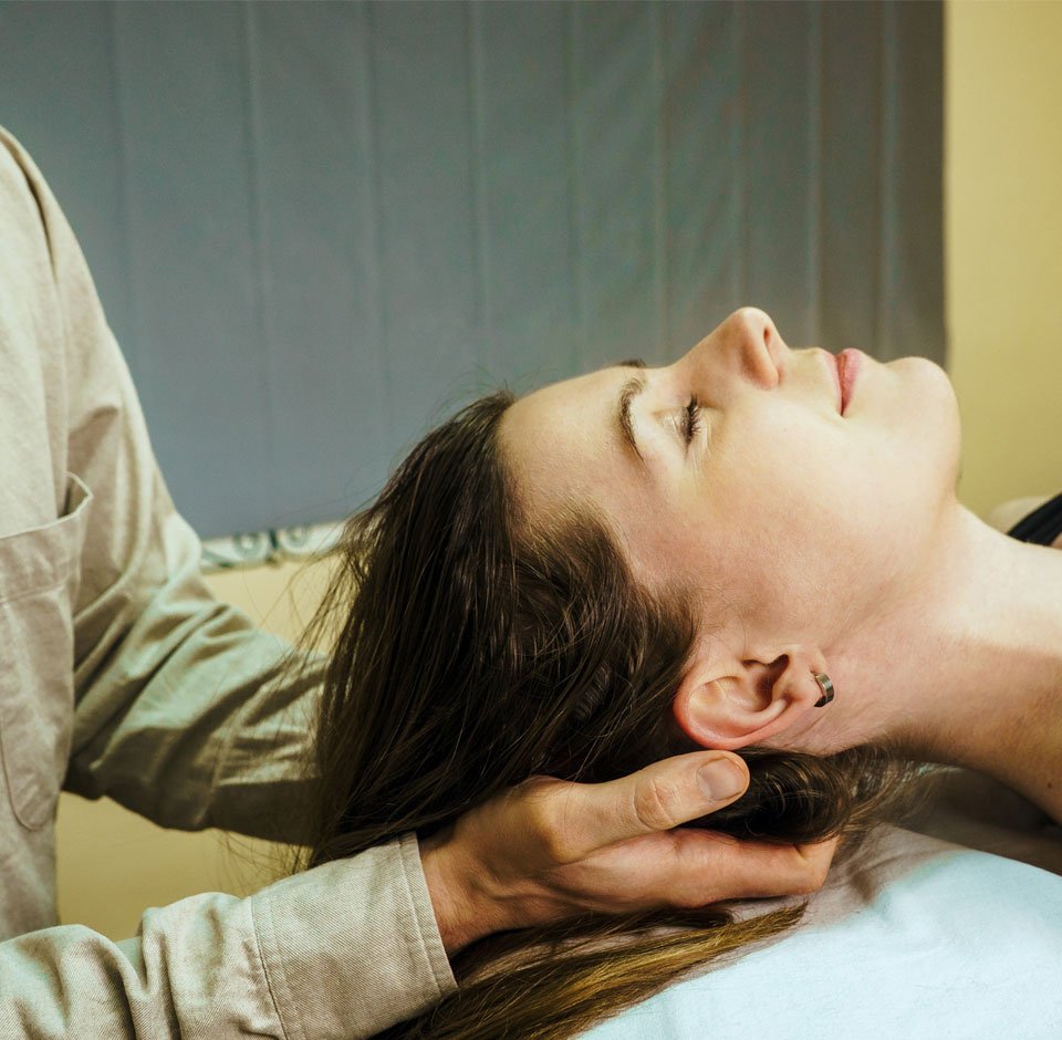 chiropractic adjustments being done to a patient by a chiropractor